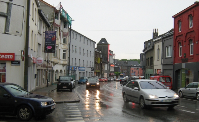 a street in bastogne in the rain